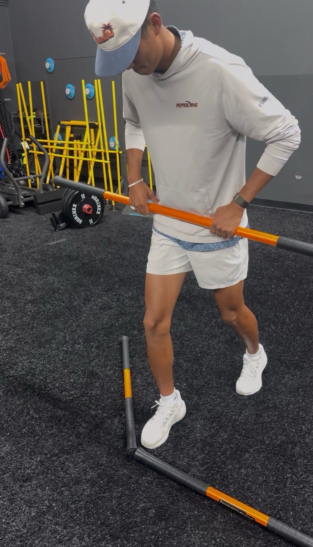 Pepperdine golfer going through a golf performance assessment movement drill at The Village ATG